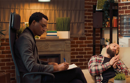 male-psychiatrist-listening-man-with-marriage-problems-trying-solve-conflict-give-counseling-advice-talking-counselor-about-psychoanalysis-therapy-session-office_482257-50929